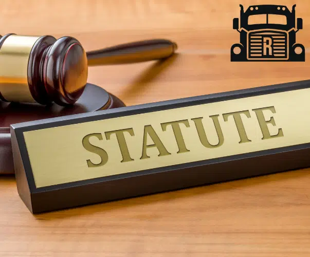 a gavel and a desk sign that reads "statute"