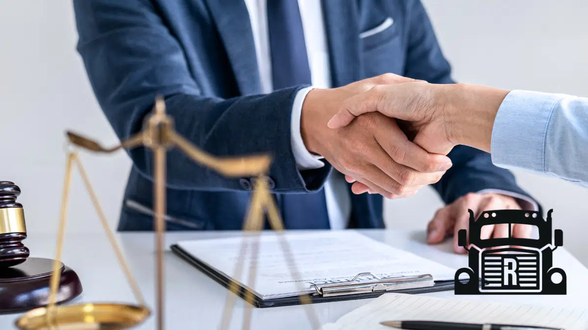 personal injury lawyer shaking the hand of a client