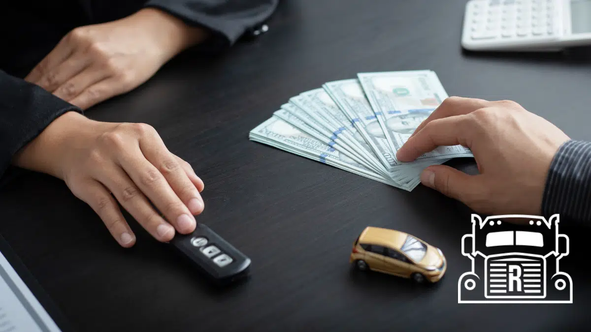settlement money, key fob, and toy car on a desk