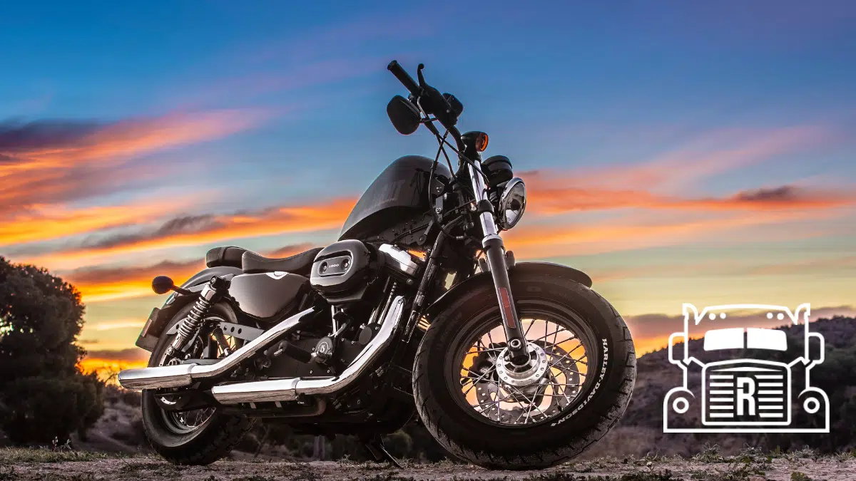 motorcycle parked with sunset background