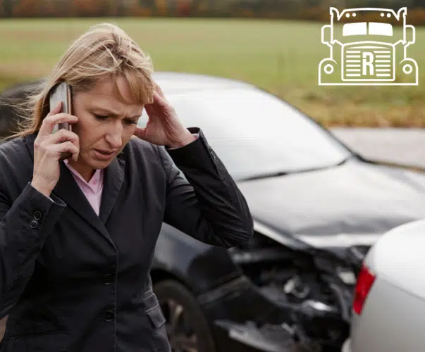 Women on the phone following her car accident