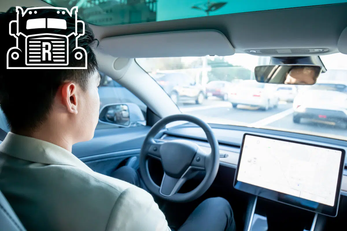 man letting a self-driving car drive itself